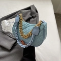 Light blue quilted hobo bag with gold chain and woven shoulder strap in a trendy style - Blue
