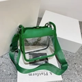 Green transparent PVC crossbody jelly bag with wide fabric strap and chain detail - Green
