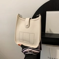 Beige bucket shoulder bag with perforated H pattern and striped colorful strap - White