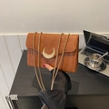 Quilted caramel brown crossbody bag with gold crescent lock and square chain strap - Brown
