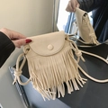 Bohemian beige faux suede crossbody bag with long fringes and vintage knot strap - White