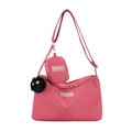Waterproof pink nylon crossbody bag with matching mini pouch and fuzzy ball charm - Single Bag / Pink