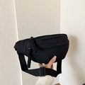 Minimalist black nylon crossbody bag with woven pull cords and adjustable wide strap - Black