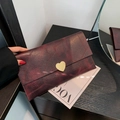 Elegant wine red leather clutch with gradient texture and golden heart-shaped clasp - Burgundy
