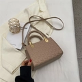 Quilted khaki crossbody bag with woven handle and gold hardware in minimalist style - Khaki