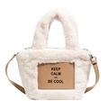 Plush faux fur bucket bag in cream white with brown leather strap and Keep Calm text - White
