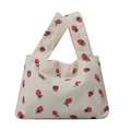 Minimalist beige knit tote bag with red strawberry pattern and unique cross-handle closure - White