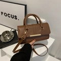 Brown litchi grain leather handbag with gold metal bar and adjustable strap - Brown