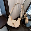 Elegant beige half-moon shoulder bag with golden butterfly clasp and knotted strap - White