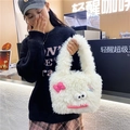 Cute white plush shoulder bag featuring a cartoon face and pink bow detail - White