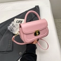 Pink matte leather crossbody bag with golden twist lock and elegant top handle - Pink