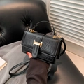 Black crocodile pattern handbag with gold H buckle and adjustable shoulder strap - Black