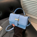 Light blue faux crocodile leather crossbody bag with a golden T-shaped buckle detail - Blue