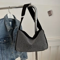 Sparkly black rhinestone crescent hobo shoulder bag styled with a denim jacket - Black Silver