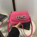 Magenta faux leather shoulder bag with rhinestone bow detail and adjustable strap - Rose Pink