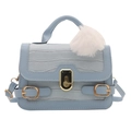 Light blue faux crocodile skin handbag with golden metal twist lock and fluffy pompom charm - Blue