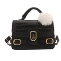 Fashionable black faux crocodile skin handbag with gold metal clasp and white pompom charm - Black