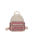 Bohemian style woven straw mini backpack with colorful wave patterns and beige straps - Wave Pink
