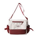 Vorderansicht der stylischen Canvas-Tragetasche in Creme und Burgund mit Gurtband - Rot