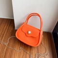 Mini orange jelly handbag with glossy finish, pearl clasp and gold chain strap - Orange Red