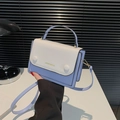 Chic two-tone crossbody bag in cream and light blue faux leather with top handle - Blue