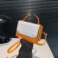 Orange and white patchwork leather crossbody bag with top handle and gold hardware - Orange Red