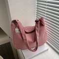 Pink corduroy tote bag with adjustable strap and cartoon puppy pendant on white background - With Pendant / Pink