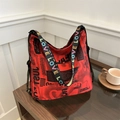 Red tote bag with black graffiti print and colorful LOVE patterned shoulder strap - Red