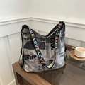 Graffiti newspaper print tote bag with colorful LOVE embroidered wide strap detail - Gray