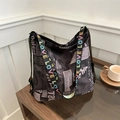 Minimalist black tote bag with newspaper print and colorful LOVE woven shoulder strap - Coffee