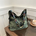 Green tote bag with retro newspaper print and colorful LOVE patterned wide strap - Green