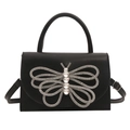 Elegante borsa in pelle nera opaca con decorazione a farfalla grande in strass lucidi - Nero