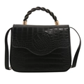 Fashionable black crocodile pattern handbag with twisted handle and gold hardware detail - Black