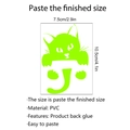 Macro shot of luminous green PVC cat wall sticker with dimensions 7.5cm by 10.5cm - Cat Shape (G017)