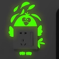 Luminous green bird-shaped glow wall sticker decorating a light switch in the dark - Cartoon Bird Style (G030)
