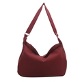 Large burgundy nylon crescent tote bag with adjustable strap for daily commute use - Red