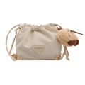 Cream white drawstring bucket bag with gold metal corners and plush dog charm - With Ornament / Off White