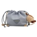 Light blue faux leather bucket bag with gold accents and a plush charm detail - With Ornament / Blue