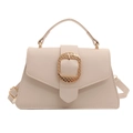 Chic beige lychee leather trapezoid handbag with decorative gold square buckle and strap - White