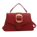 Elegant dark red lychee grain handbag with a large gold buckle and slim shoulder strap - Red
