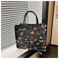 Close-up of large capacity butterfly tote bag with colorful embroidery on canvas fabric - Black