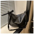 Minimalist black PU leather crescent tote bag with knotted shoulder strap detail - Black