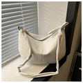Minimalist white half-moon saddle bag in soft faux leather with tied strap detail - White