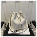 Detail of white drawstring bucket bag with silver metal chain and smooth faux leather finish - Off White