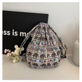 Detailed view of ethnic elephant print canvas bucket bag with drawstring closure - Pattern 1 (Elephant Print)