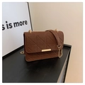 Brown quilted chain shoulder bag in textured felt fabric with elegant gold metal bar detail - Brown