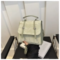 Detail of pistachio green handbag with pleated texture and silver metal buckle closure - Green
