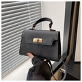 Detail of black sequin patchwork handbag with gold metal twist lock and matte flap - Black