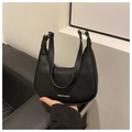 Close-up of black crescent hobo bag in lychee pattern leather with silver logo - Black