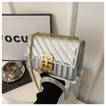 Quilted silver chain crossbody bag with metallic finish and gold rectangular lock for women - Silver